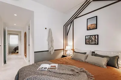 a bedroom with a large bed with two books on it at Botijo - 2 bedrooms in Eixample Esquerra in Barcelona