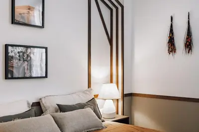 a living room with a bed and a lamp at Botijo - 2 bedrooms in Eixample Esquerra in Barcelona