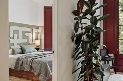 a living room with a table and a couch at Brisa - 1 bedroom and balcony in Sant Antoni in Barcelona