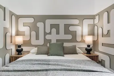 a bedroom with a bed and a large plant at Brisa - 1 bedroom and balcony in Sant Antoni in Barcelona
