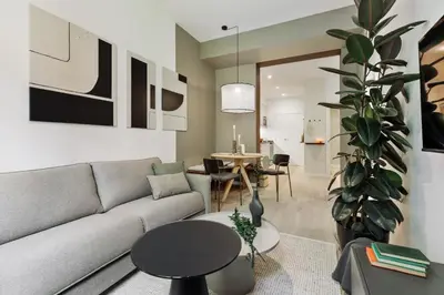 a living room with a table and a couch at Brisa - 1 bedroom and balcony in Sant Antoni in Barcelona