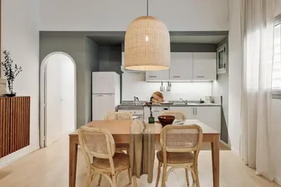 a living room with a couch and a staircase at Panot - 2 bedrooms and terrace in Gràcia in Barcelona