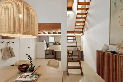 a bedroom with a bed and a chair in a room at Panot - 2 bedrooms and terrace in Gràcia in Barcelona