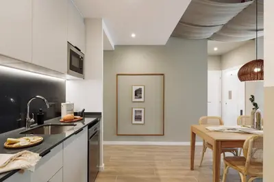 a living room with a couch and a table at Murtra - 2 bedrooms in Sant Antoni in Barcelona