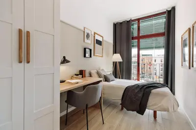 a kitchen and dining room with a table and chairs at Murtra - 2 bedrooms in Sant Antoni in Barcelona