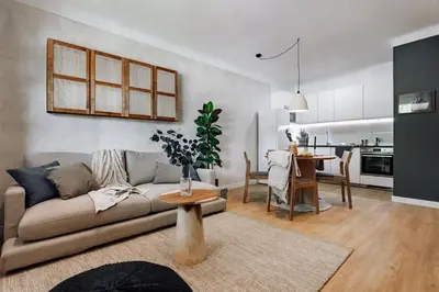 a living room with a table and a couch at Arros - 2 bedroom in El Born in Barcelona