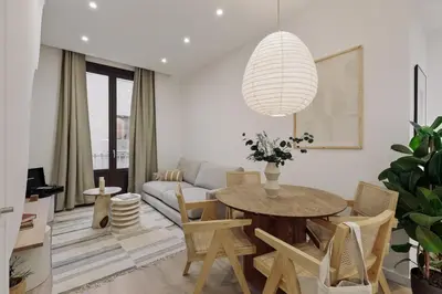a bedroom with a bed and a desk and a mirror at Praiano - 2 bedrooms, balcony and terrace in Ciutat Vella in Barcelona
