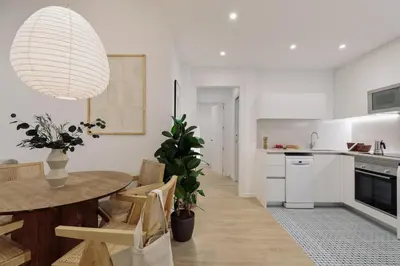 a bedroom with a bed and a desk and a bed sidx sidx sidx at Praiano - 2 bedrooms, balcony and terrace in Ciutat Vella in Barcelona
