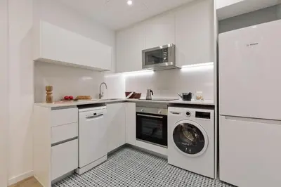 a living room with a flat screen tv on a wall at Praiano - 2 bedrooms, balcony and terrace in Ciutat Vella in Barcelona