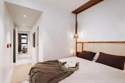 a bathroom with a table and a sink and a mirror at Encina - 2 bedrooms in Eixample Esquerra in Barcelona