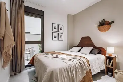 a table and chairs in a room with plants at Encina - 2 bedrooms in Eixample Esquerra in Barcelona