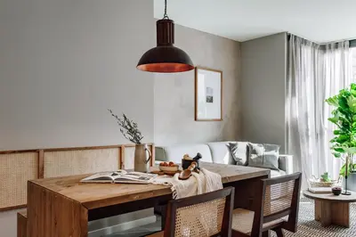 a dining room with a table and a couch at Encina - 2 bedrooms in Eixample Esquerra in Barcelona
