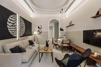 a patio with chairs and a table and a plant at Halite - 2 bedrooms, terrace, and balcony in Gràcia in Barcelona