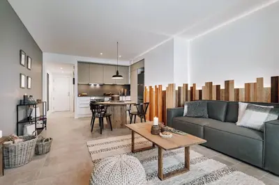a bedroom with a bed and pictures on the wall at Taull - 3 bedrooms in Eixample Esquerra in Barcelona