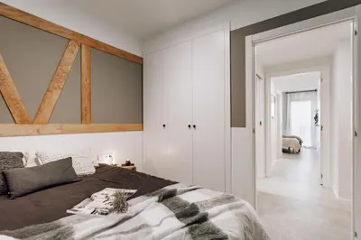 a bedroom with white cabinets and a large bed at Taull - 3 bedrooms in Eixample Esquerra in Barcelona