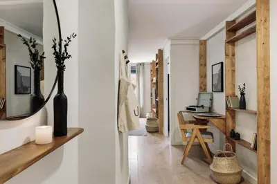 a gray couch in a living room with a plant at Canet - 1 bedroom in Ciutat Vella in Barcelona
