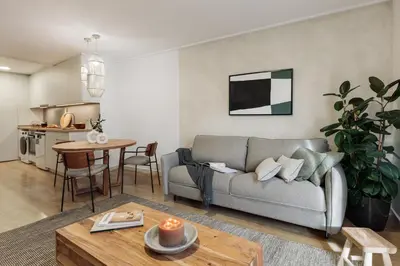 a living room with a couch and a table at Canet - 1 bedroom in Ciutat Vella in Barcelona