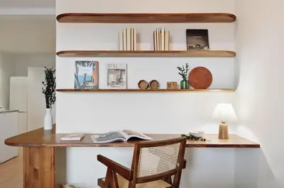 a wooden desk with a lamp and a book at Quinta - 1 bedroom in Sants in Barcelona