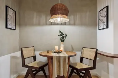 a living room with a dining room table and chairs at Quinta - 1 bedroom in Sants in Barcelona