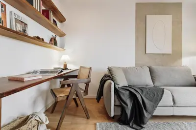 a bathroom with a sink and a bed at Quinta - 1 bedroom in Sants in Barcelona
