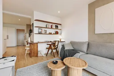 a living room with a couch and a flat screen tv at Quinta - 1 bedroom in Sants in Barcelona