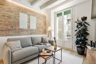 a bedroom with a large bed and a window at Ebre - 1 bedroom and balcony in Eixampre Esquerre in Barcelona