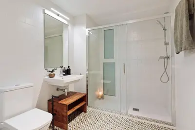 a hallway with a living room and a dining room at Ebre - 1 bedroom and balcony in Eixampre Esquerre in Barcelona