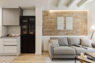 a desk with a mirror and a table with a lamp at Ebre - 1 bedroom and balcony in Eixampre Esquerre in Barcelona
