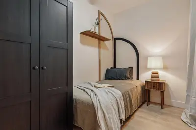 a living room with a table and a tv at Yaz - 2 bedrooms and balcony in El Putxet in Barcelona