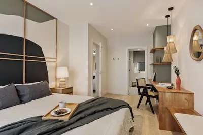 a bedroom with a bed and a black cabinet at Yaz - 2 bedrooms and balcony in El Putxet in Barcelona
