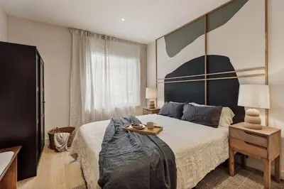 a bedroom with a bed and a desk and a desk at Yaz - 2 bedrooms and balcony in El Putxet in Barcelona