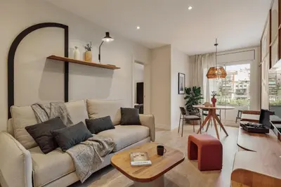 a living room with a couch and a table at Yaz - 2 bedrooms and balcony in El Putxet in Barcelona