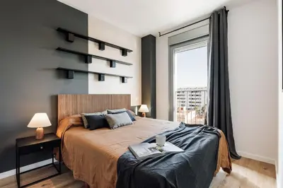 a white bathroom with a sink and a shower at Roc - 2 bedrooms in Poblenou in Barcelona