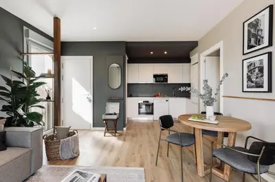 a bedroom with a bed and a table and a desk at Roc - 2 bedrooms in Poblenou in Barcelona