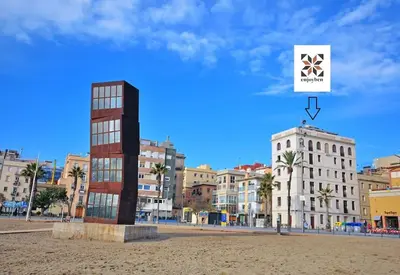 a view of a city with buildings and a sign at Barceloneta Mar Street - BM11 in Barcelona