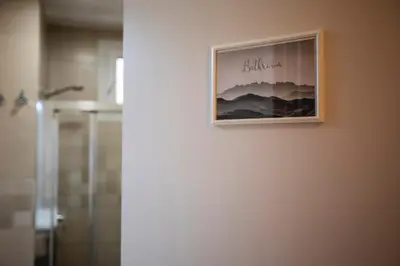 a picture hanging on a wall in a bathroom at Habitación L'Elefant en Casa Camí de les Aigües Monistrol de Montserrat in Monistrol