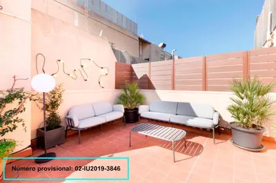 a patio with two benches and a table at Enjoy Apartments Calle Paris Super Stylish II in Barcelona