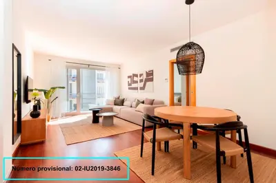 a living room with a table and a couch at Enjoy Apartments Calle Paris Super Stylish II in Barcelona