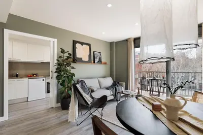 a living room with a couch and a table at Oreneta - 1 bedroom and pool in Les Corts in Barcelona