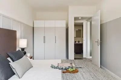 a living room with a couch and a table at Oreneta - 1 bedroom and pool in Les Corts in Barcelona