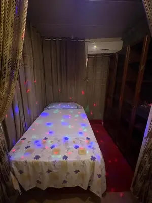 a bedroom with a bed with a white comforter at Habitación camp nou in Barcelona