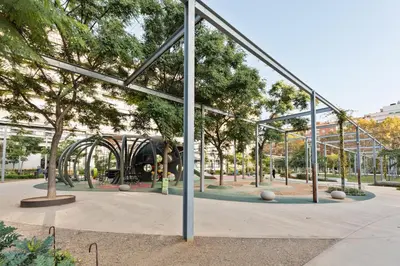 a playground with a train in a park at Enjoy Apartments Ecuador in Barcelona
