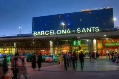 a group of people walking in front of a store at Apartments BCN Central-Atico Sants in Barcelona