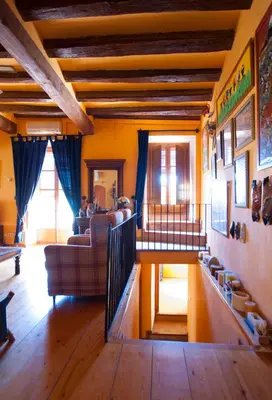 a living room with a couch and a table at Can Julià de Masia Olivera in Subirats