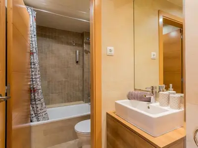 a bathroom with a sink and a toilet and a shower at Matarolux28 in Mataró