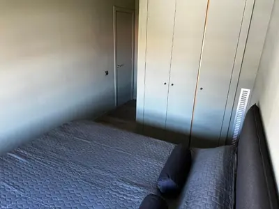 a bedroom with a bed and a closet at The Olive in Barcelona