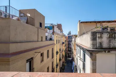 an overhead view of an alley between buildings at AinB Born-Dames Apartments in Barcelona
