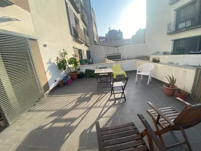 a patio with chairs and a table on a balcony at Long Stays Terrassa Near Center in Terrassa