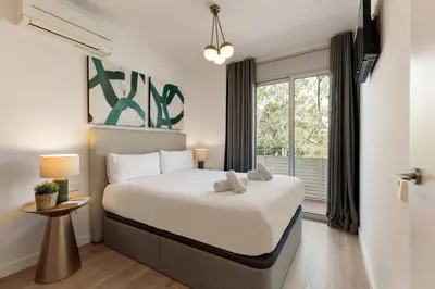 a bedroom with a large bed and a window at Ola Living Poblenou Beach in Barcelona