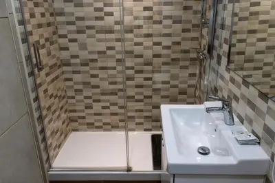 a bathroom with a shower and a sink at Apartments BCN Central-Drassanes in Barcelona